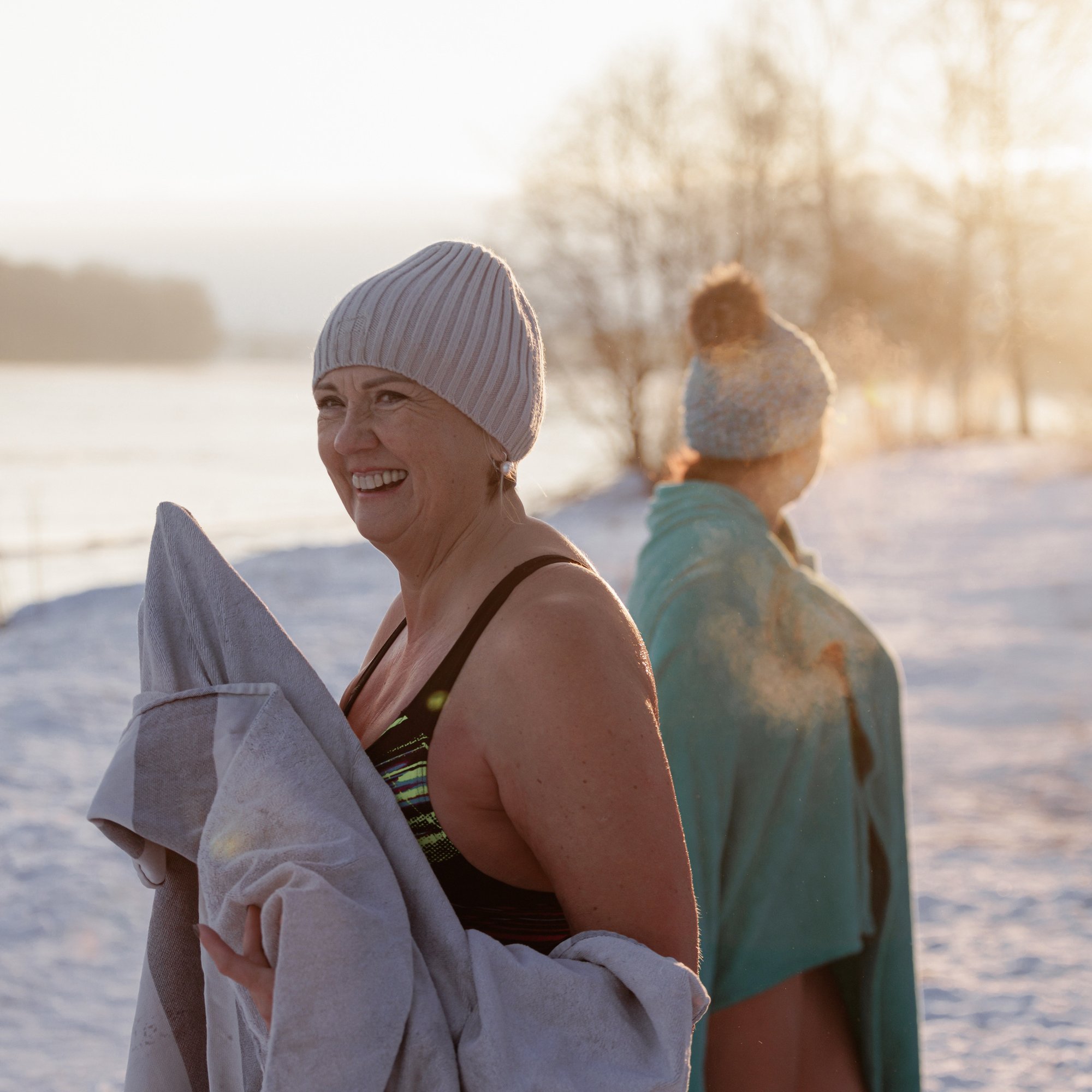 women in swimsuits in a winter landscape.